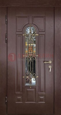 Темная железная дверь со стеклом и ковкой для частного дома ДСК-156 в Волгограде